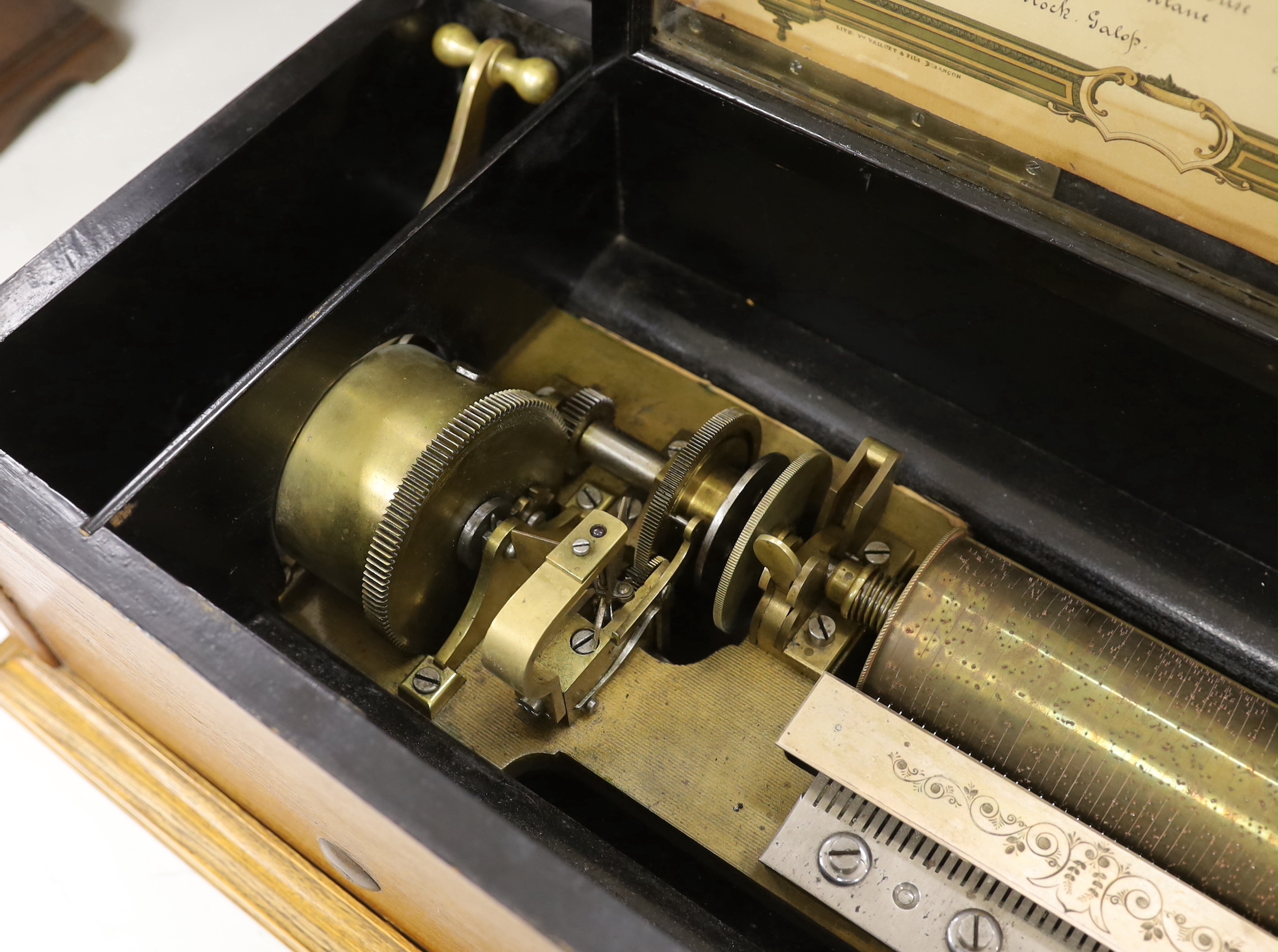 A late 19th century Swiss musical box with 92 tooth comb (one tooth broken and missing), with eight tune 13 inch cylinder and two additional cylinders, the case re-veneered in oak, 79cm wide